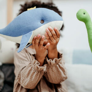 Boy Holding Whale toy